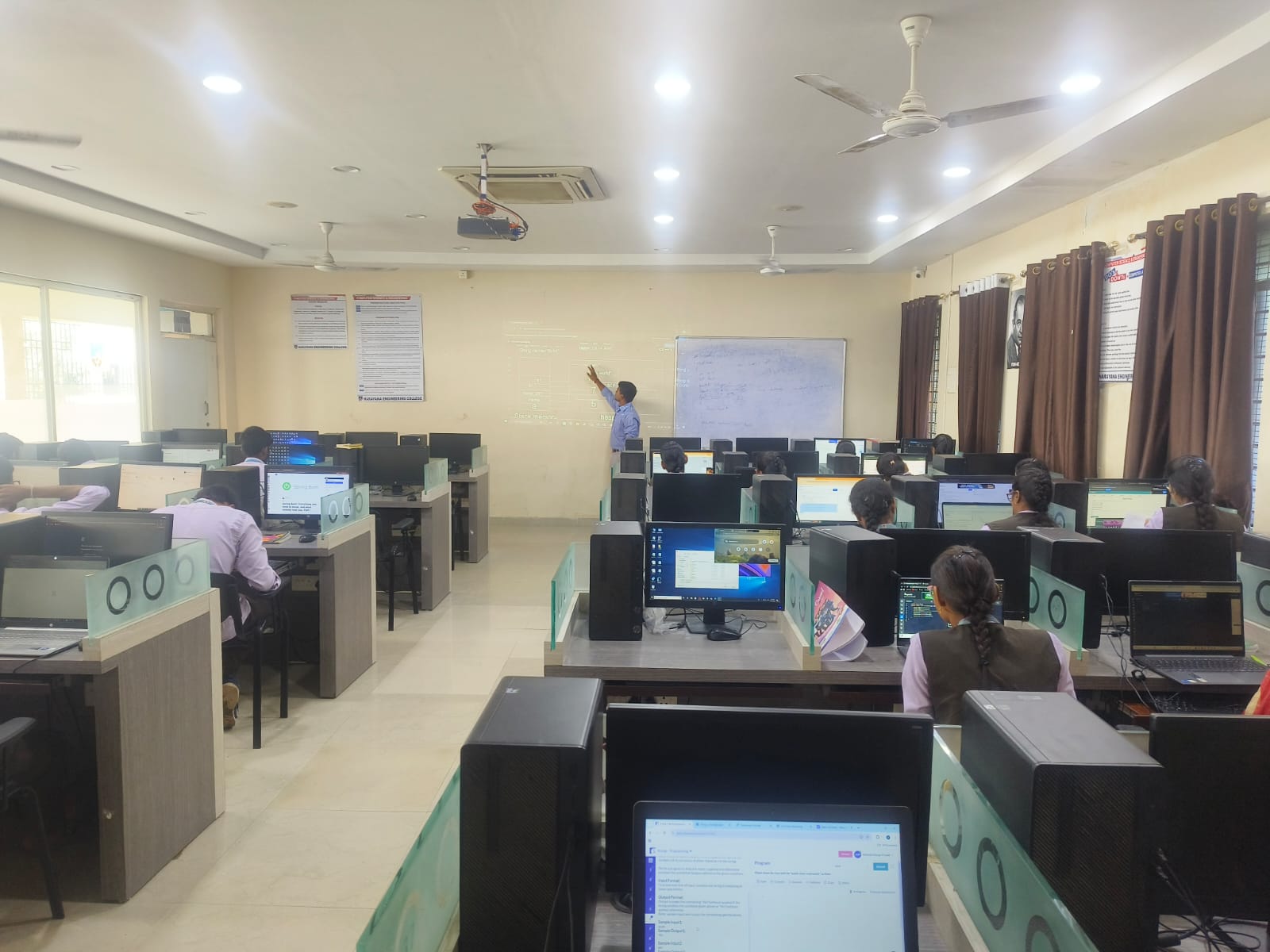 Students attending CodeAcharya training sessionwith laptops